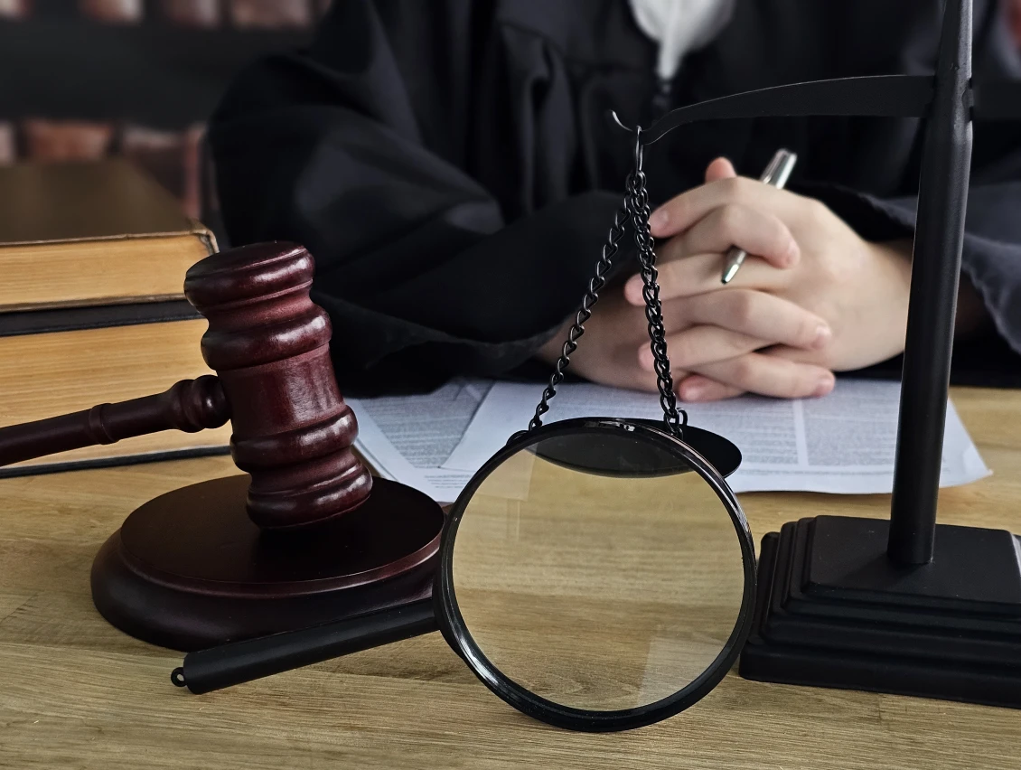 Judge in courtroom with justice symbols