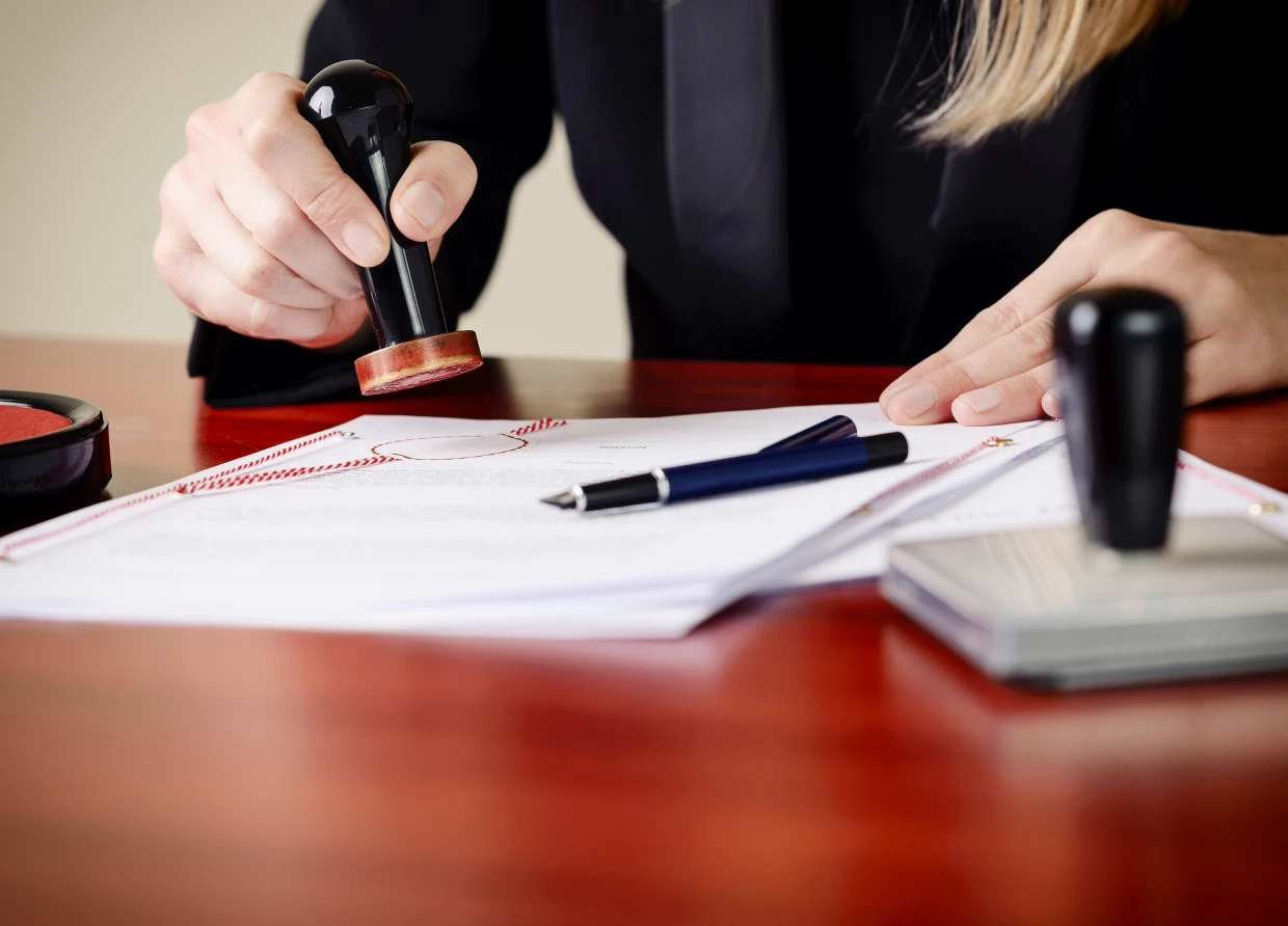 Stamping documents on wooden desk